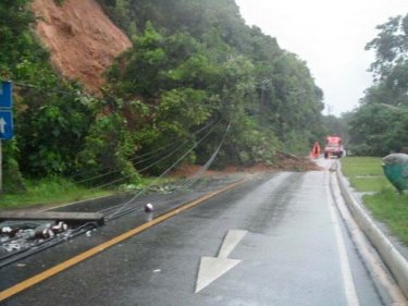 Part of the coast road is blocked by a landslip on Phuket early today
